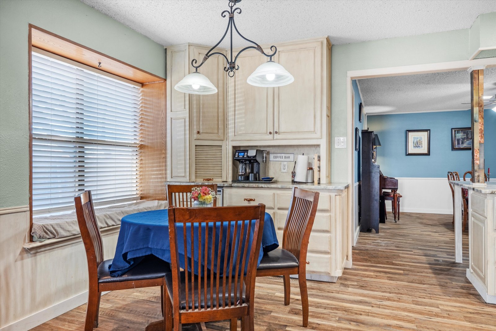07-1613 St James Dr-07 Kitchen coffee bar with built-in cabinetry and integrated beverage refrigerator at 1613 Saint James Drive.