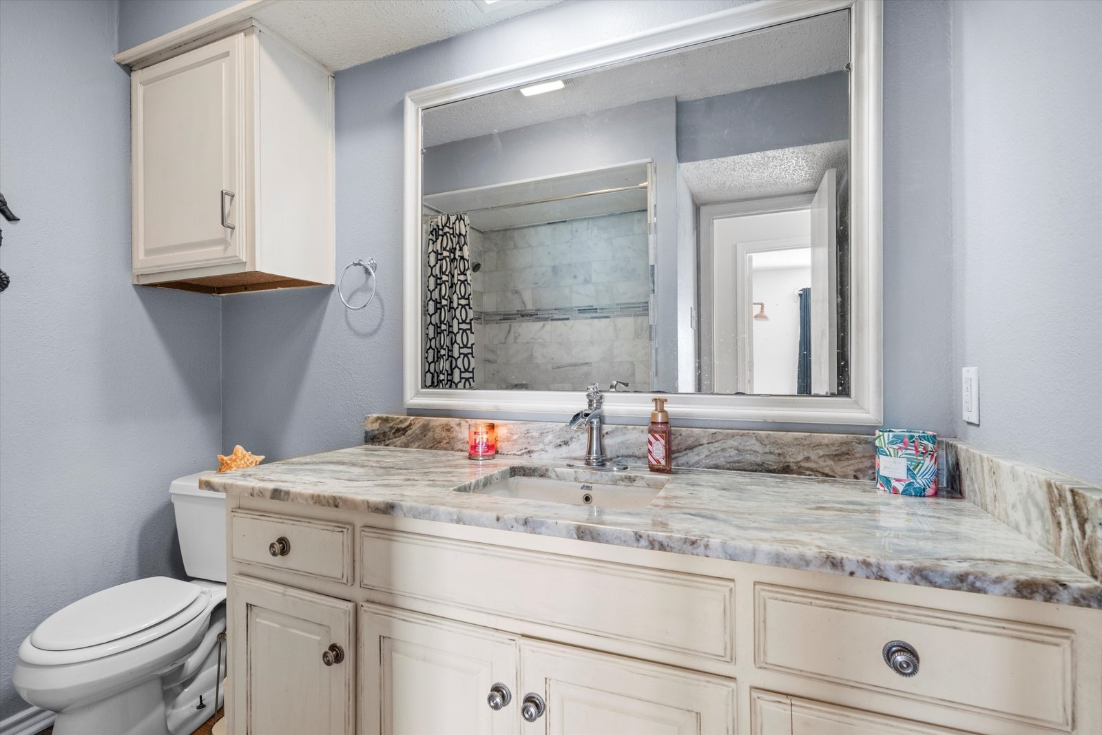 15-1613 St James Dr-15 Hall bathroom with single vanity, stone-style countertop, and tub-shower combination at 1613 Saint James Drive.