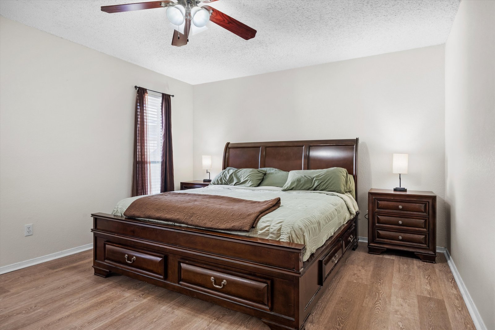19-1613 St James Dr-19 Primary bedroom featuring ceiling fan, spacious layout, and room for large furniture at 1613 Saint James Drive.
