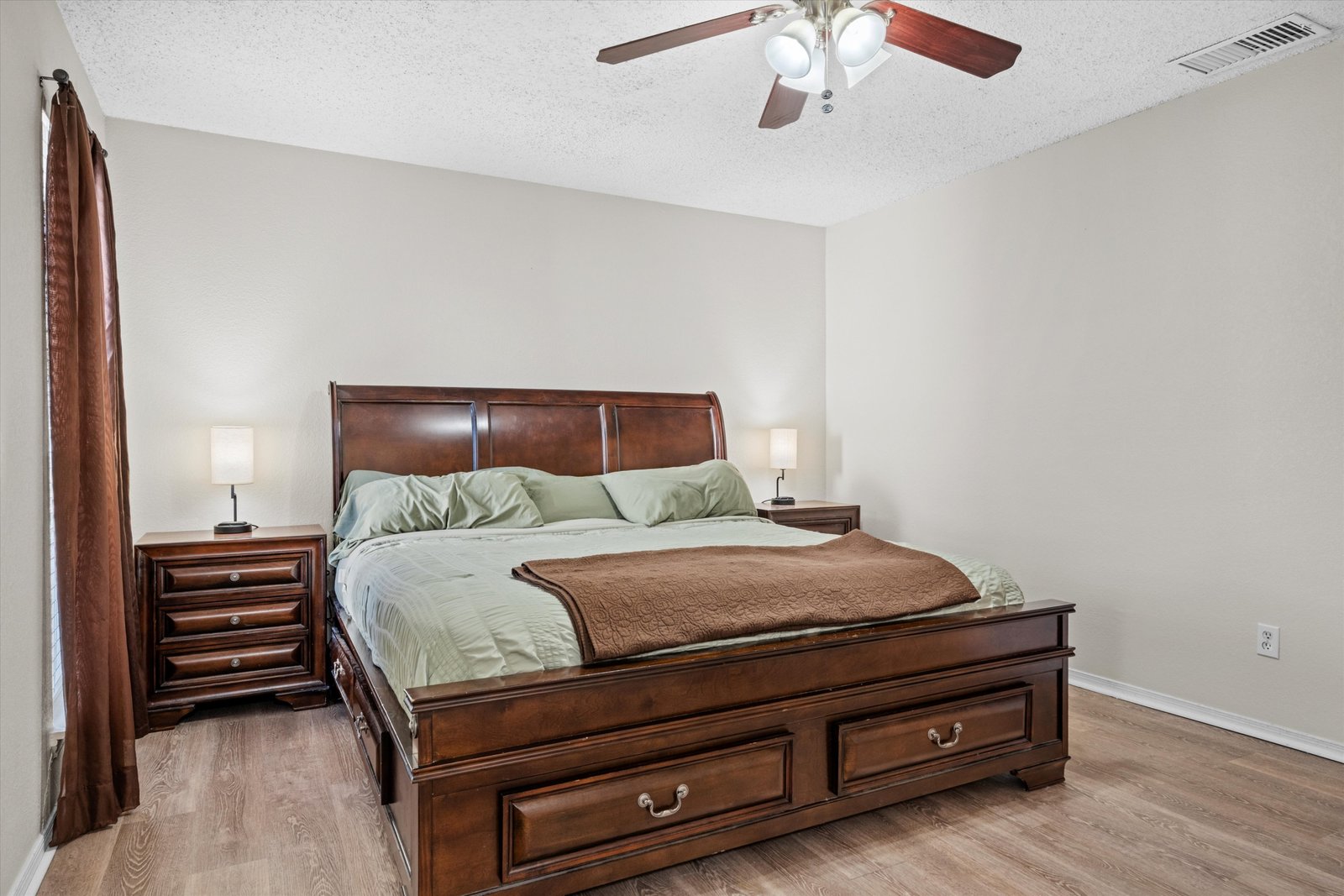 20-1613 St James Dr-20 Primary bedroom featuring ceiling fan, spacious layout, and room for large furniture at 1613 Saint James Drive.