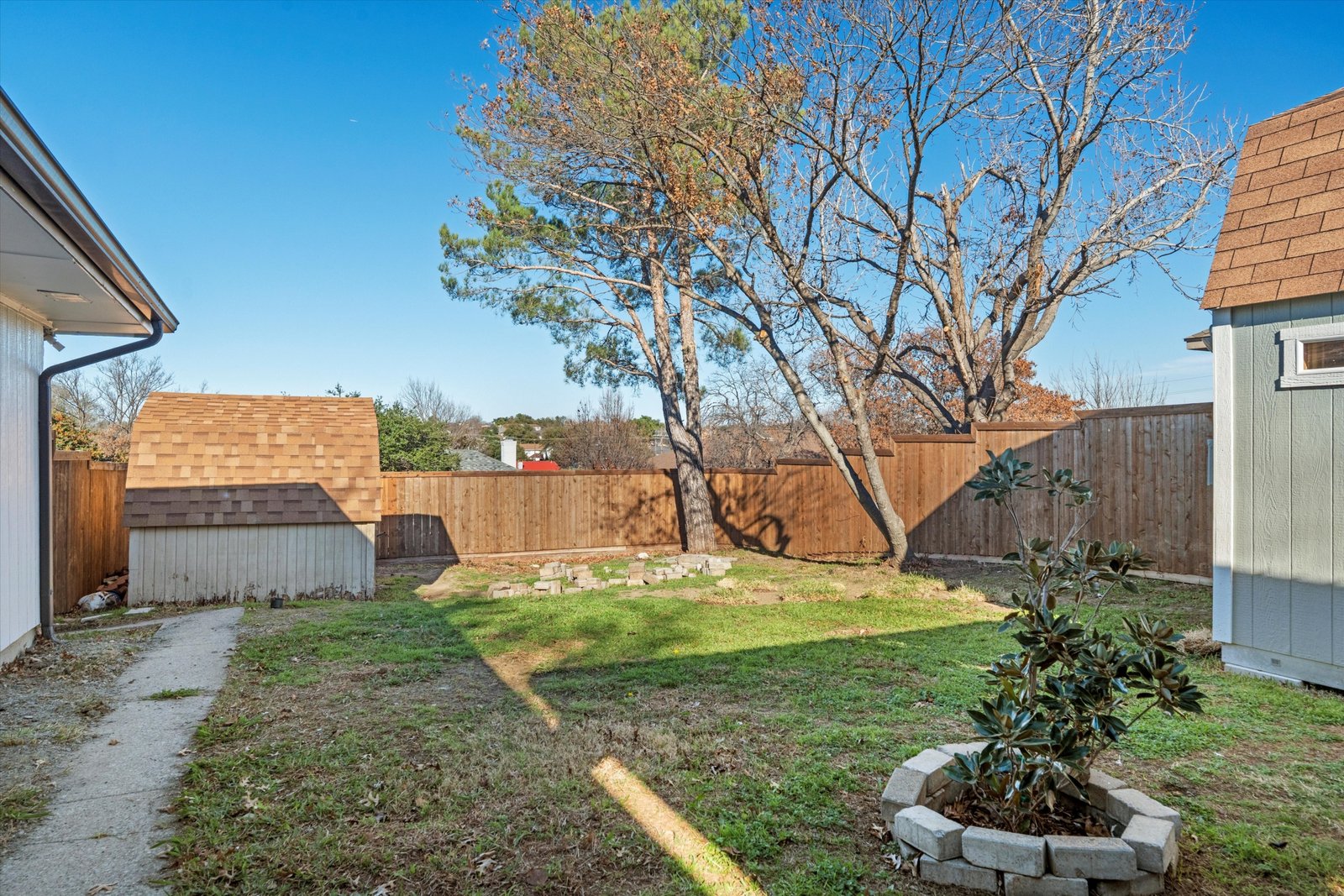 23-1613 St James Dr-23 Backyard with additional storage shed and fenced yard at 1613 Saint James Drive.