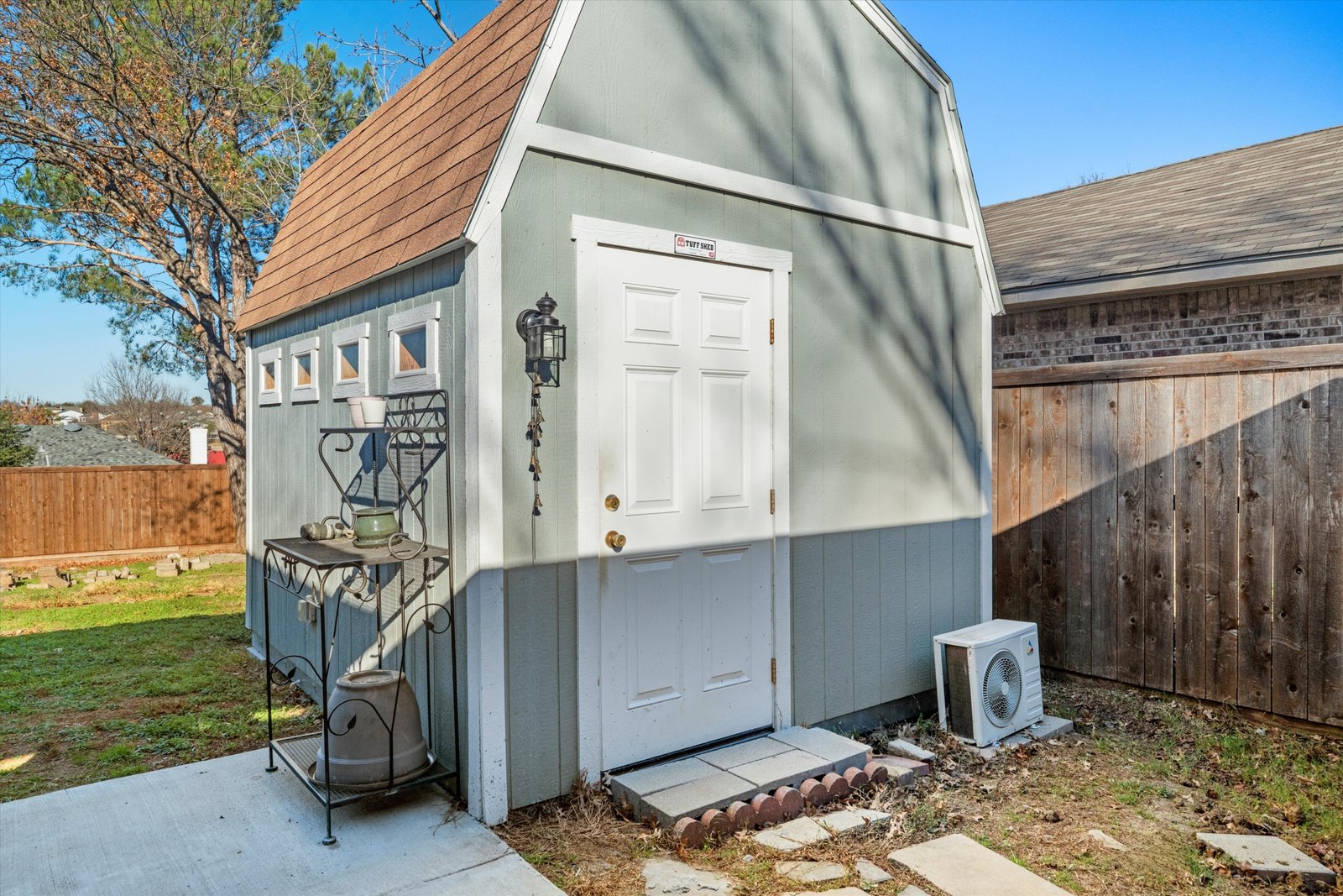 25-1613 St James Dr-25 Climate-controlled bonus shed with electricity and heating and cooling, currently used as a craft room or workshop at 1613 Saint James Drive.